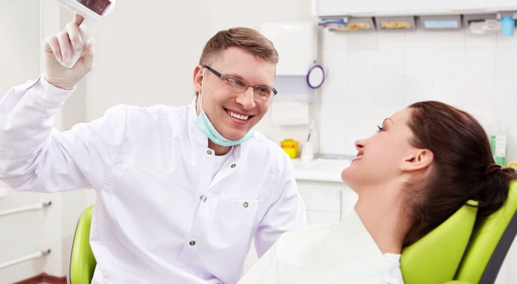 Tooth Root Canal Dentist With Patient