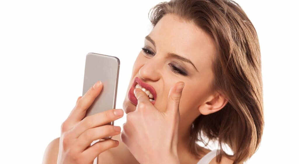 tooth discolouration types lady on phone